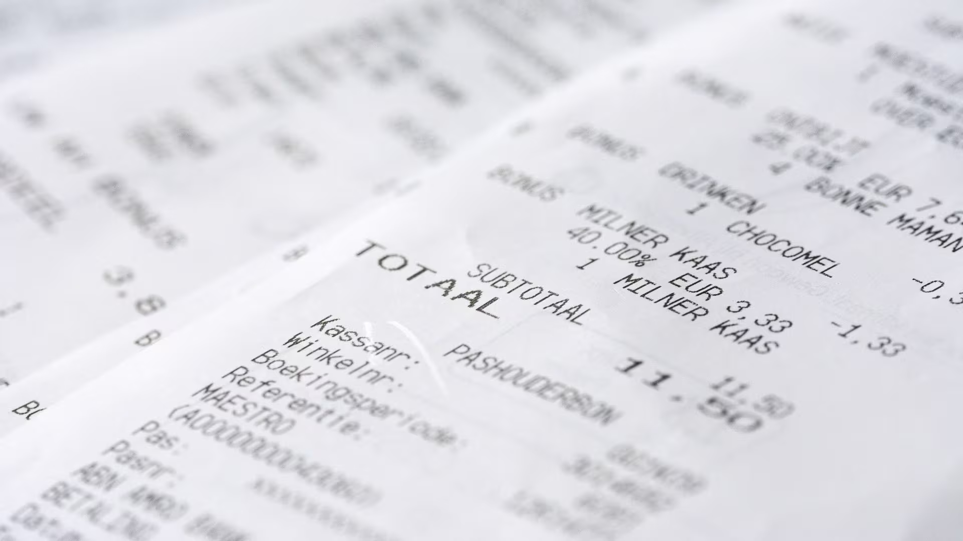 Close-up of a printed supermarket receipt being digitised