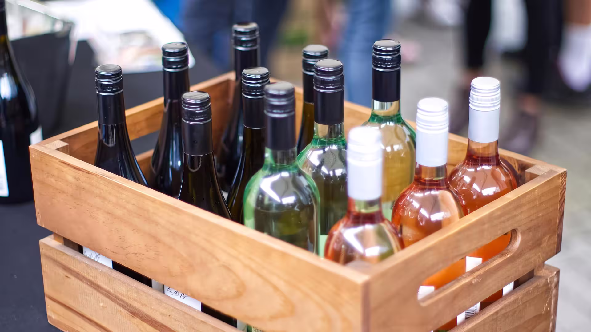 Crate of wine bottles with labels being validated before release