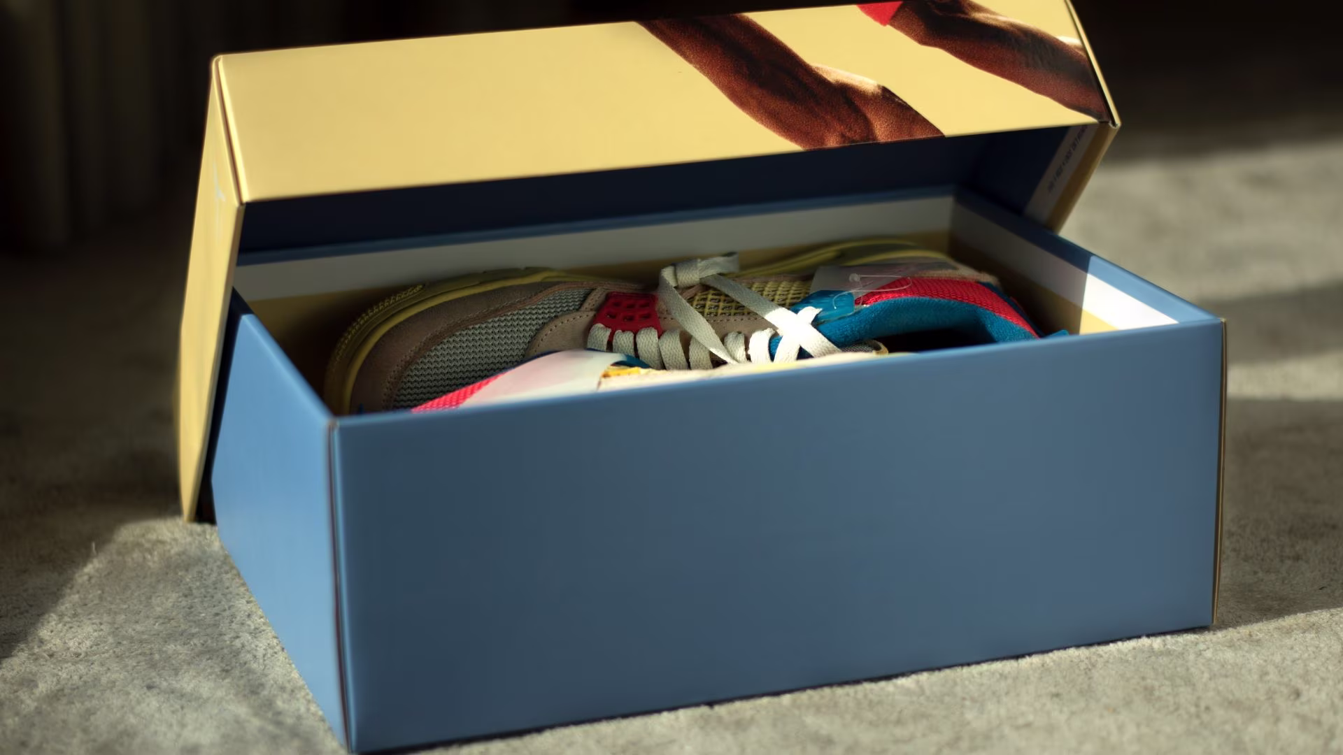 An open shoe box with a shoe inside, ready for a returns check