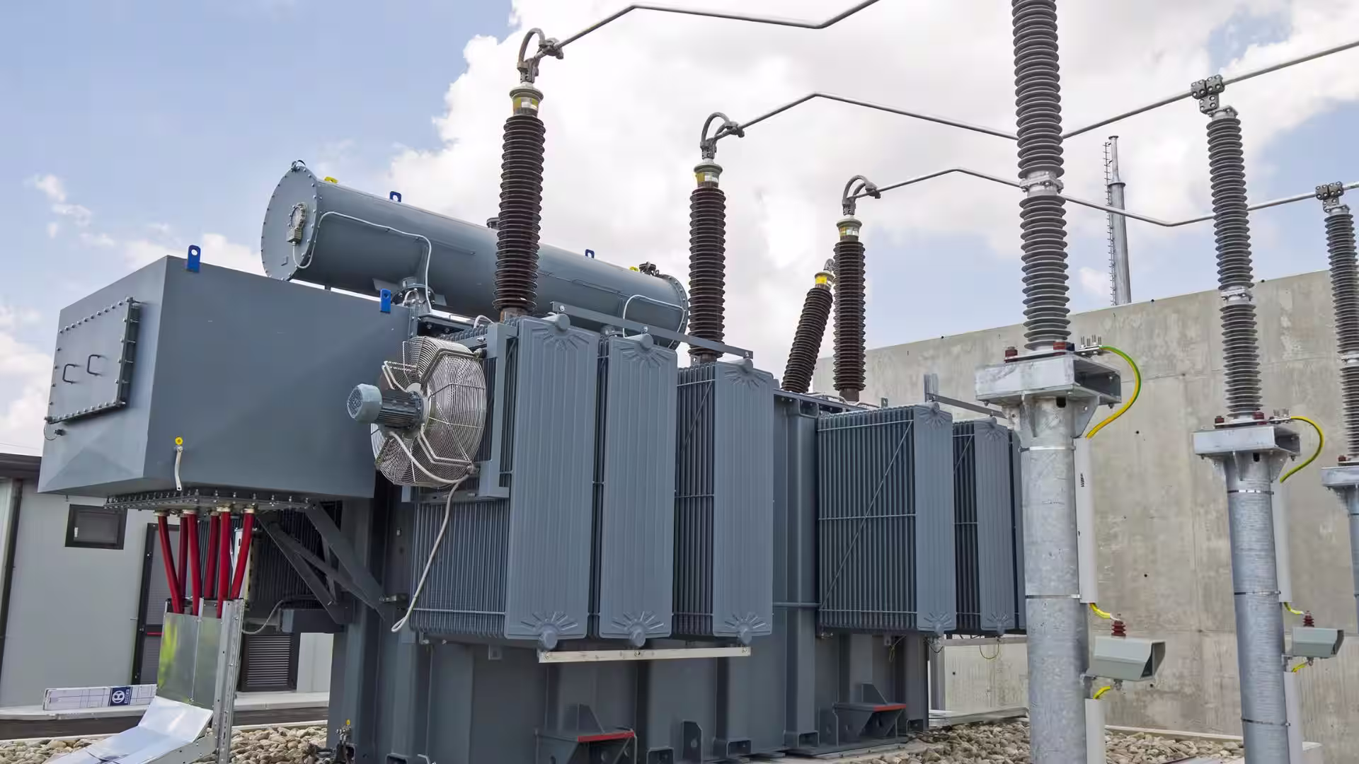 An outdoor electrical transformer and its enclosure at a substation