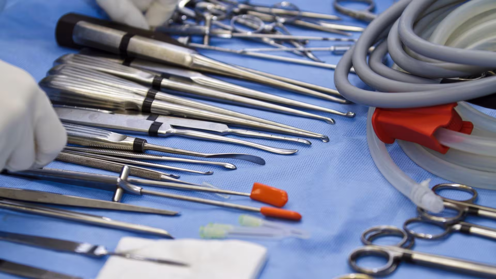 Surgical instruments laid out on a sterile tray