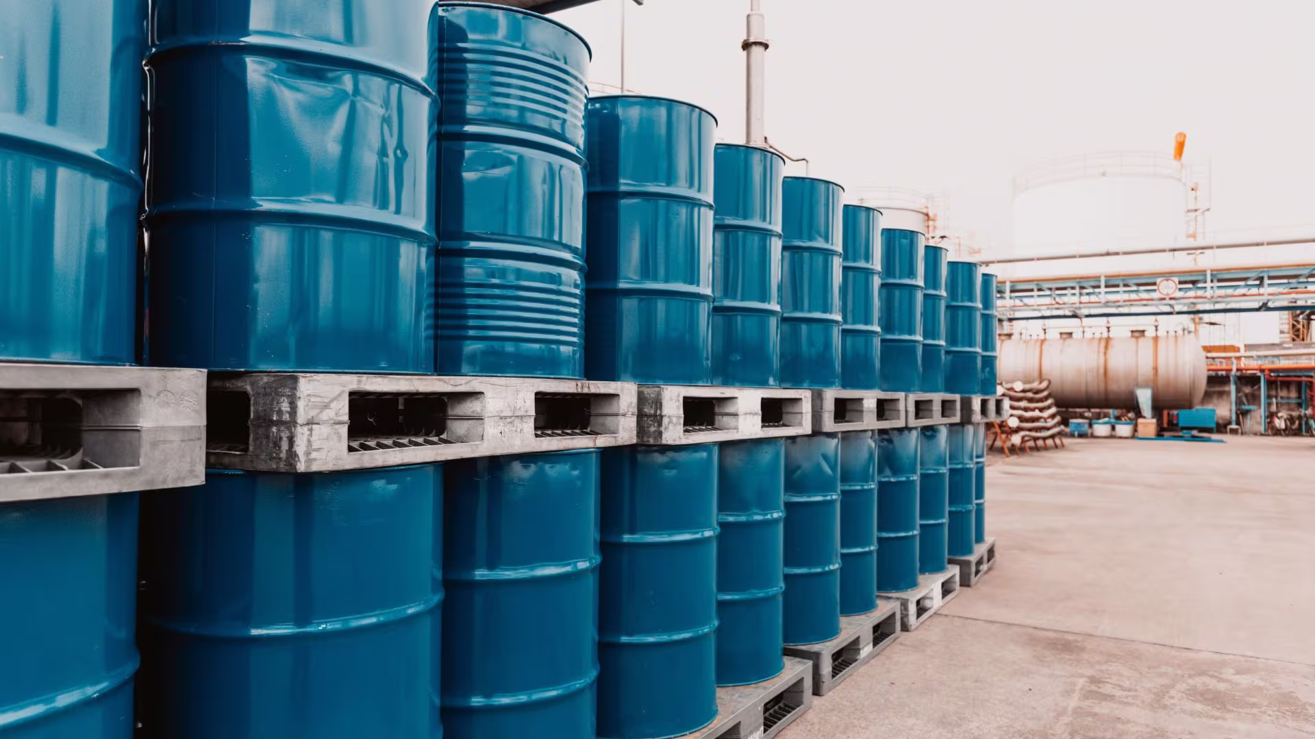 Industrial drums in a chemical store, labelling being read